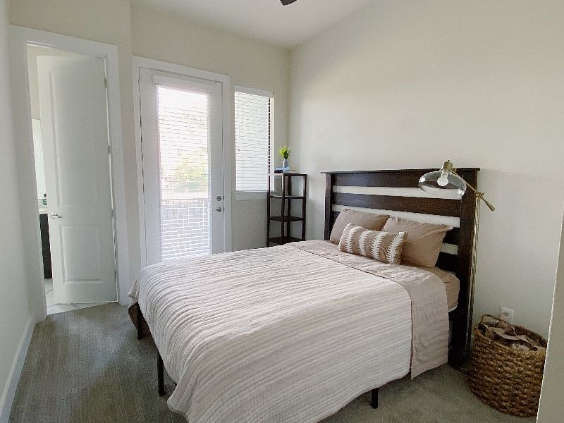 This guest room also has access to a covered porch that overlooks a field.