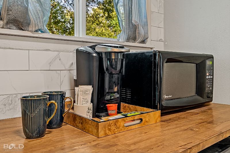 Coffee bar, microwave, hot plate, and mid-size fridge provided.