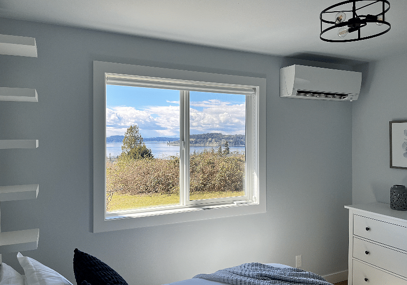air conditioned, blackout roller shades, and a view of Puget Sound and the Olympic Mountains from bed