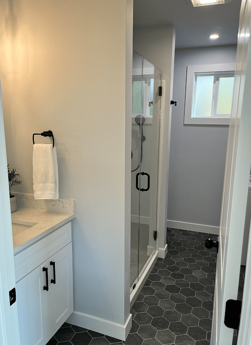 beautiful bathroom w/ linens and blow dryer