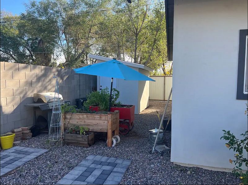 Garden and shed you can use half of the shed for additional storage. Side yard the backyard is shared with both homes