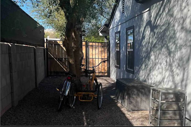 Side backyard this is the path you walk to get to your home. Or if you park on the other side you can park right in front of your home and the Parking is covered.