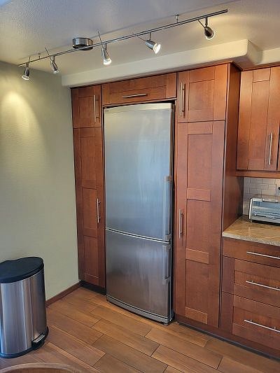 Pantry storage on either side of the refrigerator.