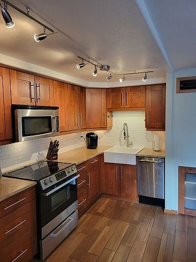 Smooth top stove, microwave, and studio dishwasher.