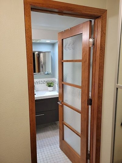 Entry to bathroom which is adjacent to the bed area.