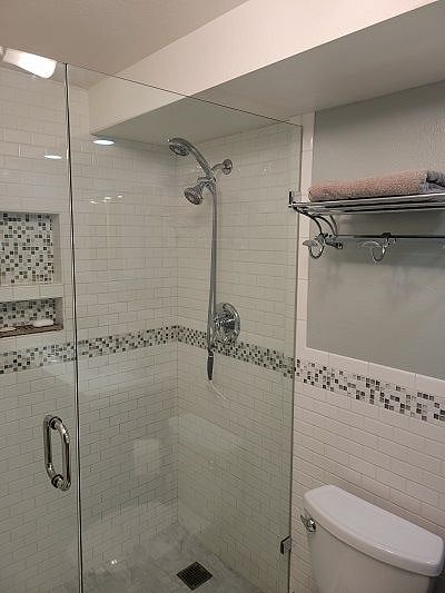 Additional towel storage above toilet