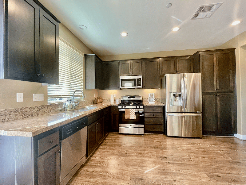 Rarely used kitchen; fully equipped with stainless steel appliances: refrigerator, built-in microwave, stove-top, oven and dishwasher. 