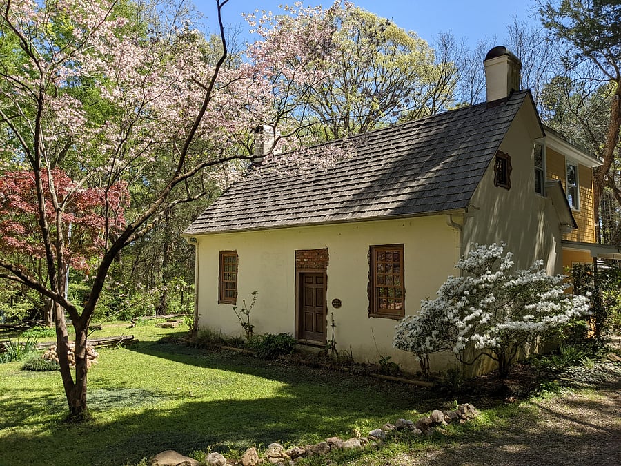 Front and west side shows room available at right window on white historic building