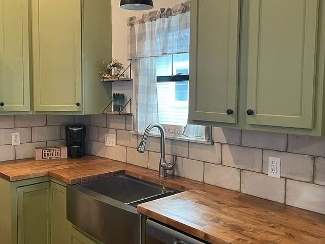 Stainless farm sink, butcherblock countertops.