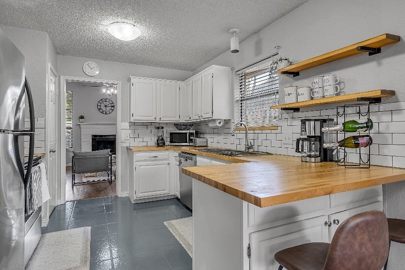 Full Kitchen with 4 dining areas and bar area with 2 stools
