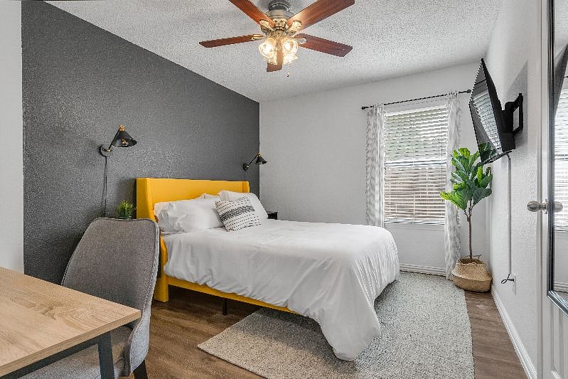 Bedroom w/ Queen Sized Bed and dedicated work space