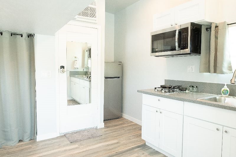 Fridge is tucked away in the corner