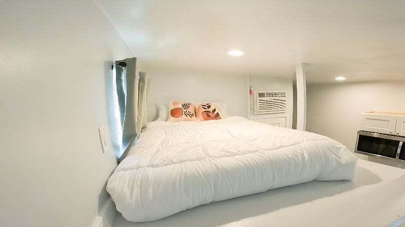Lofted bed with window and outlet