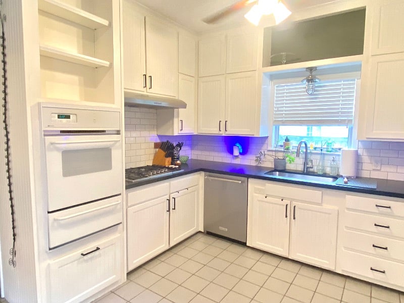 View showcasing appliances - gas stove, dishwasher, and oven