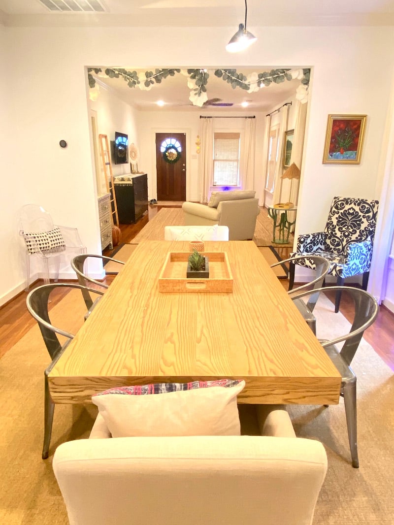 Dining room with large wood table and seating for 6 people. Also a great work space with plenty of outlets.
