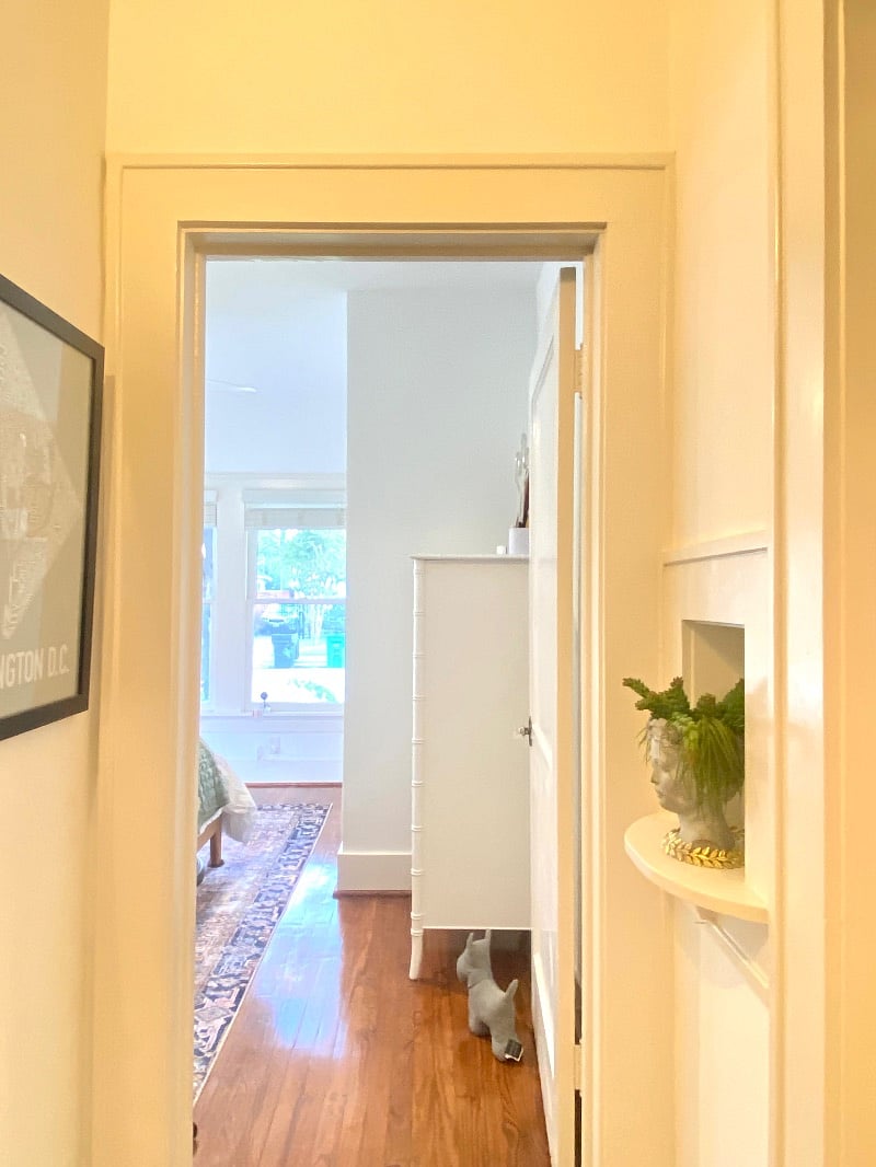 Small hallway off of living room going to the bathroom and 2 bedrooms.