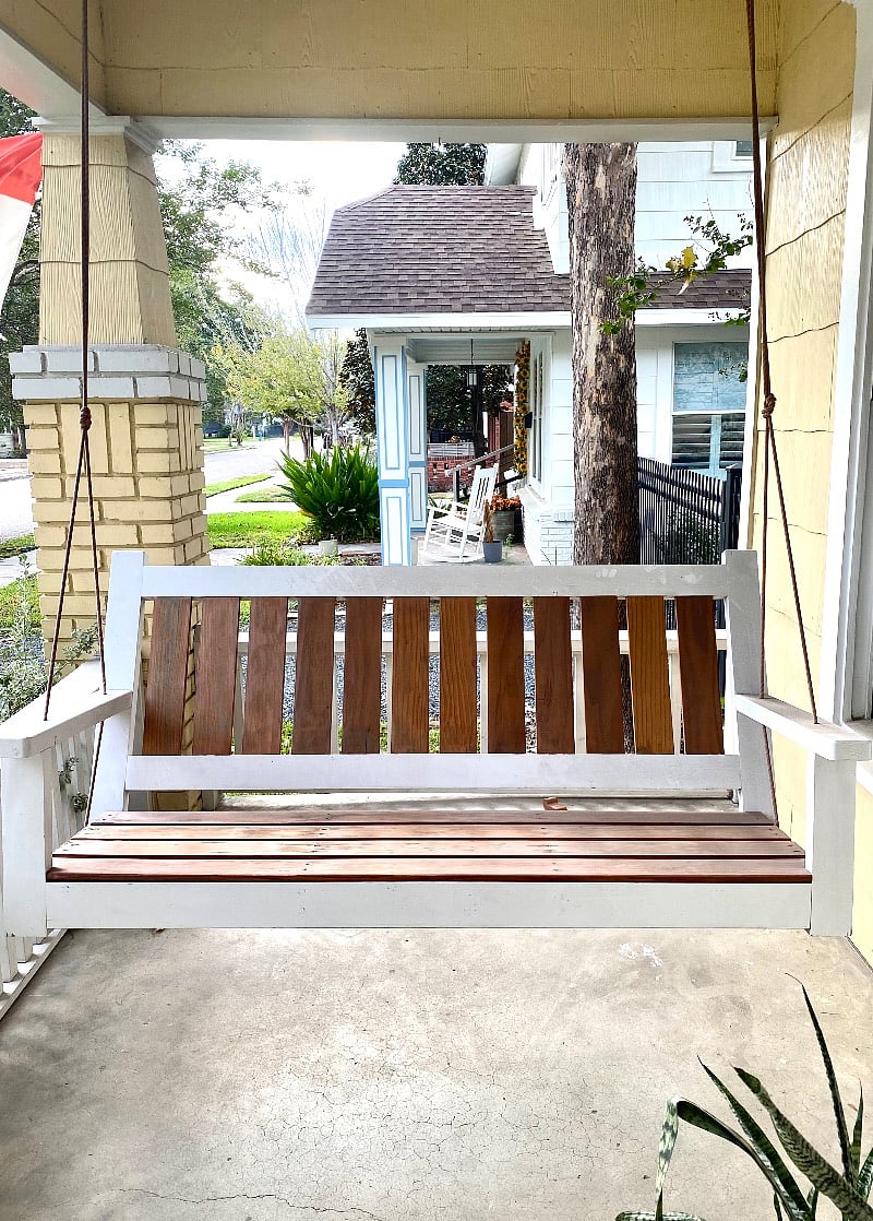 Nice front porch with swing outside front door and overhead ceiling fan (not pictured)