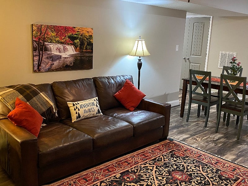 Large leather sofa to relax adjacent to the dining area