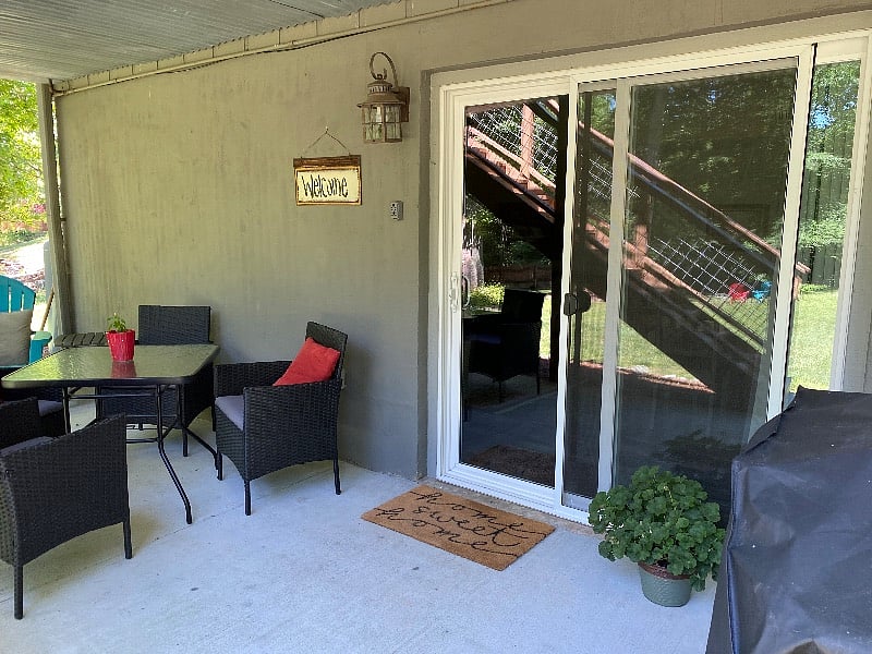 Large sliding entrance door lets in lots of natural light. Grill to cook out is next to door