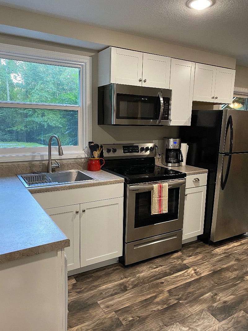Full kitchen with view to peaceful wooded yard
