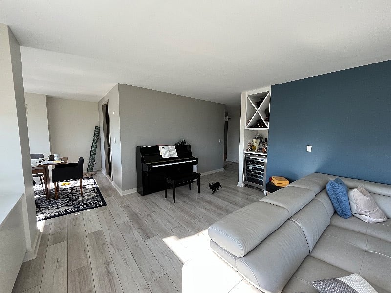Shared living room, looking towards dining room and kitchen (behind wall)