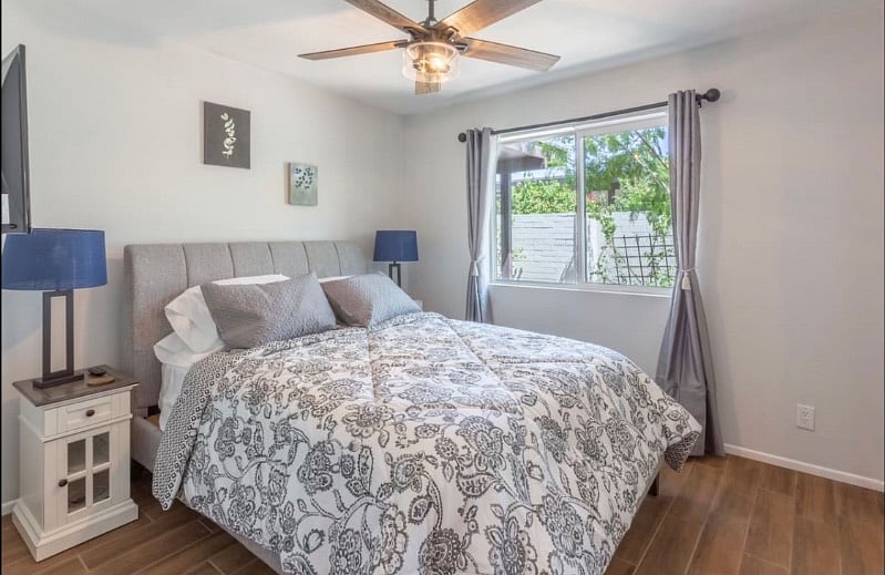 Queen bed with closet mirror doors.
