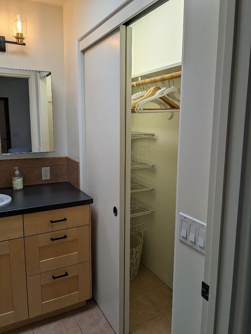 Interior closet with adjustable basket drawers and shelves