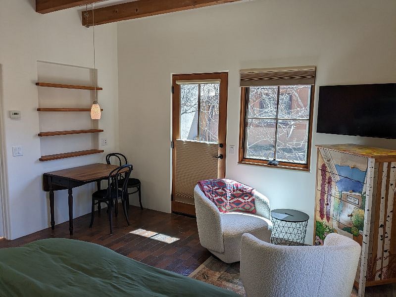 Dining and/or work table; two bentwood chairs with cushions; built-in shelves