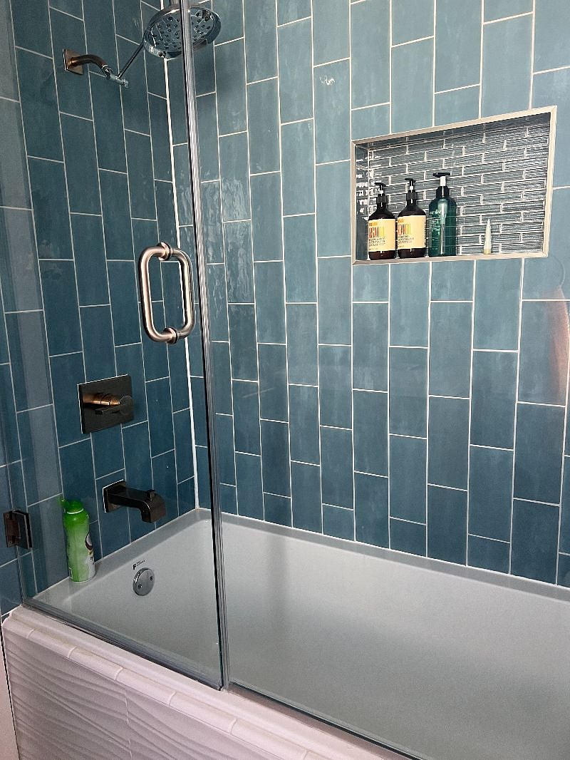 newly renovated with glass door enclosure