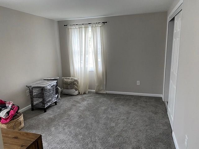 Bedroom with large dresser and nightstand
