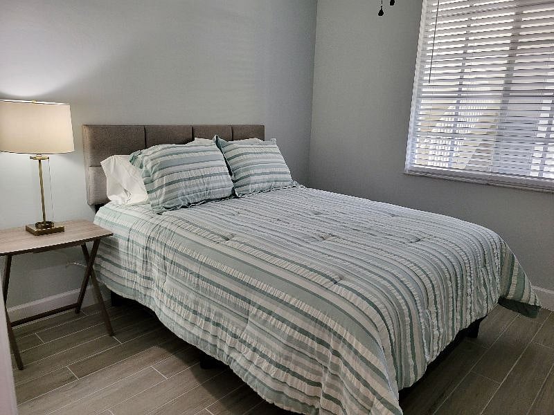 Clean and airy guest bedroom.
