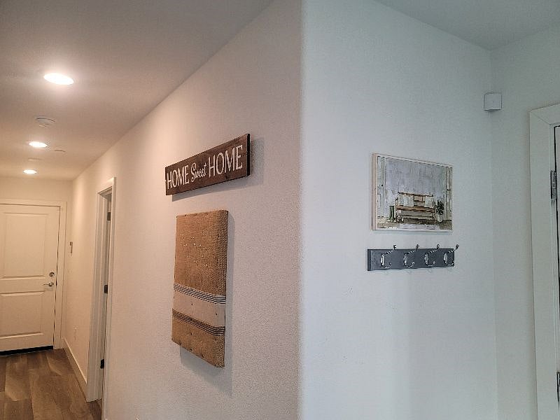 Entry, hall leading to 1st floor bed/bath and to garage