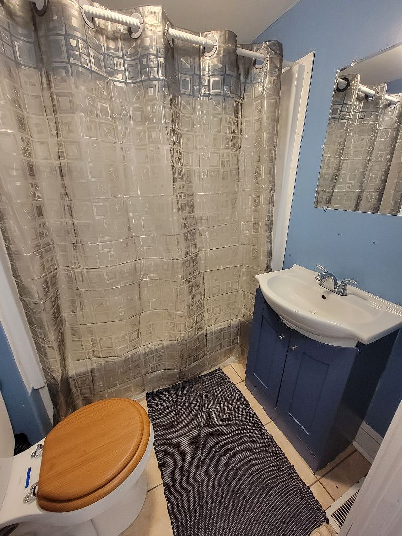Restroom with bathtub and shower