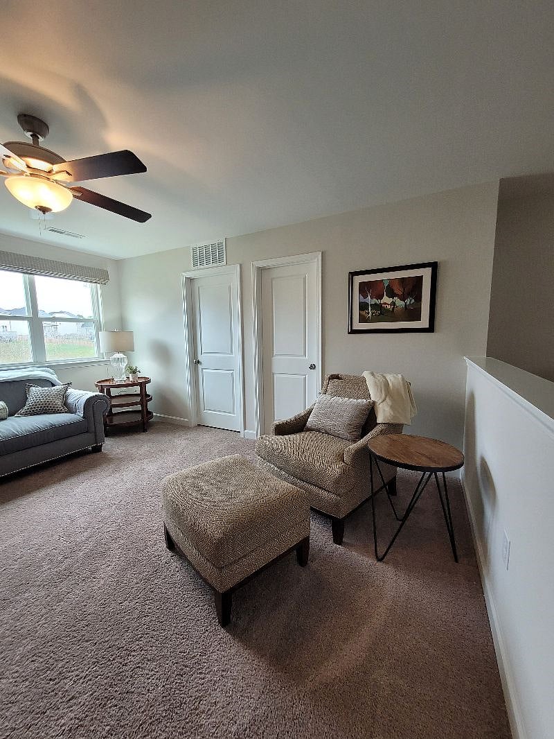 Upstairs sitting area with tv
Laundry room is the left door