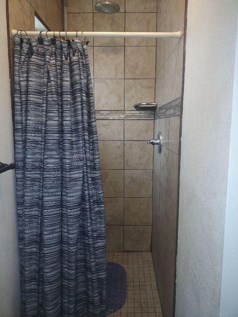 Full bathroom on the back of the house no bathtub  .