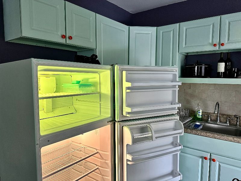Kitchen with full-sized frig.
