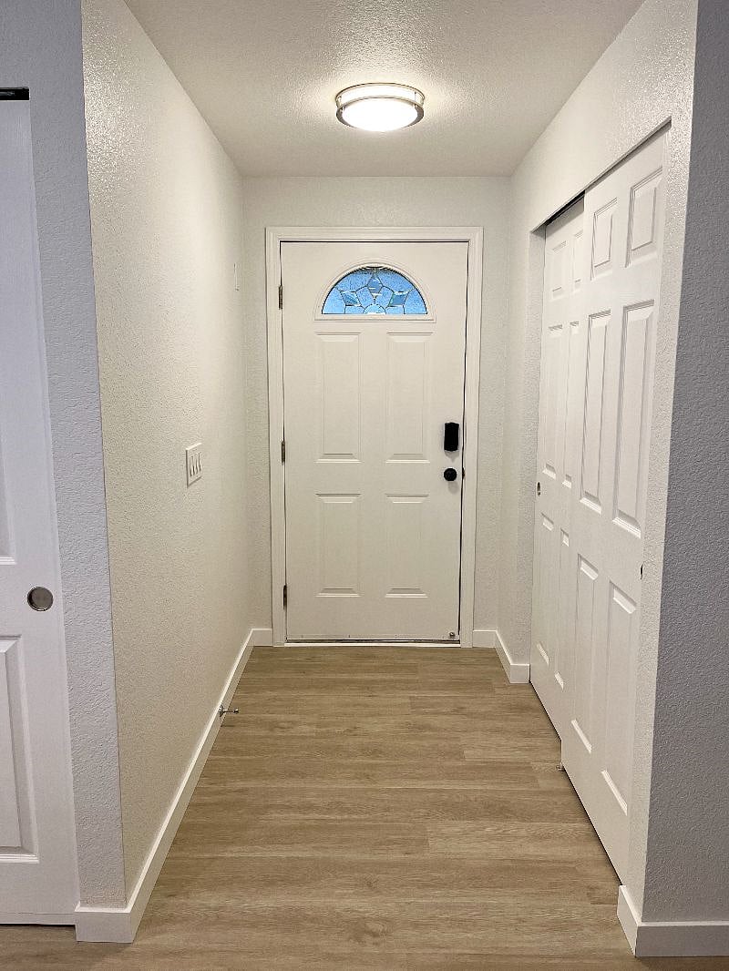 The entrance hallway features a spacious closet