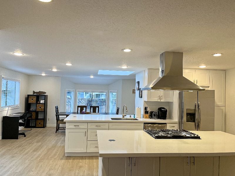 Open concept floorplan - looking from the living area onto the kitchen and dining room