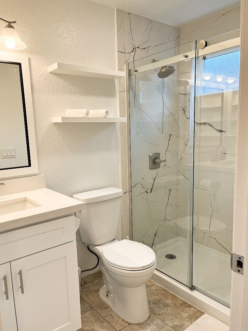 The master bath features a walk-in shower