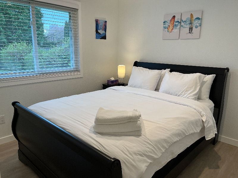 You'll find a queen size bed in the third bedroom; the window faces the front yard