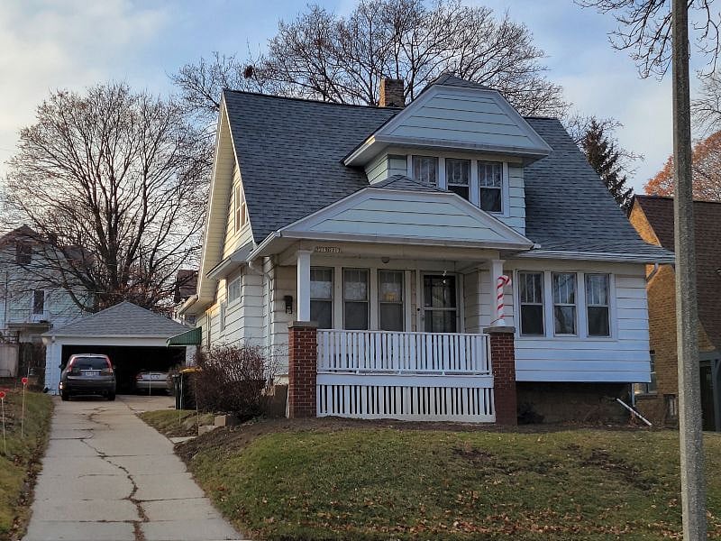 Front of House & Drive Leading to Garage