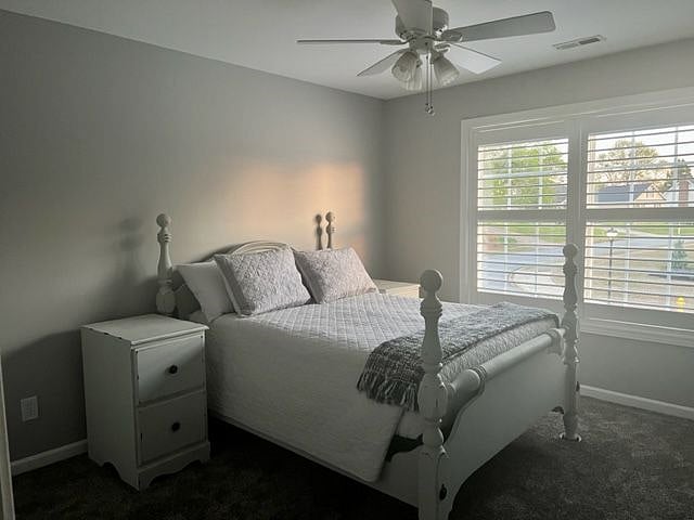 Bedroom #1 facing front of property & showing lots of natural light and Grayson Drive.