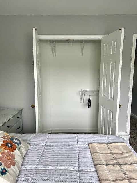 Bedroom #2 closet.  While not a walk-in closet it contains ample closet space.