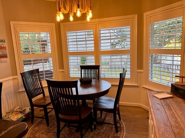 Eating space off the kitchen.  The lighting shows a bit yellow because the ceiling light fixture has retro lighting, but the space is very well lit with lots of natural light.  Available as common space.