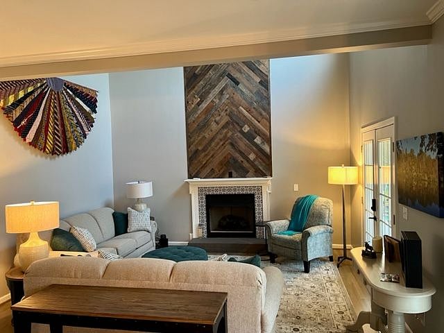 Fully furnished living room with a gas fireplace.  Available as common space.