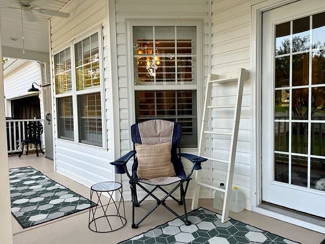Large back porch with small cafe table & 2 chairs.  Common area.