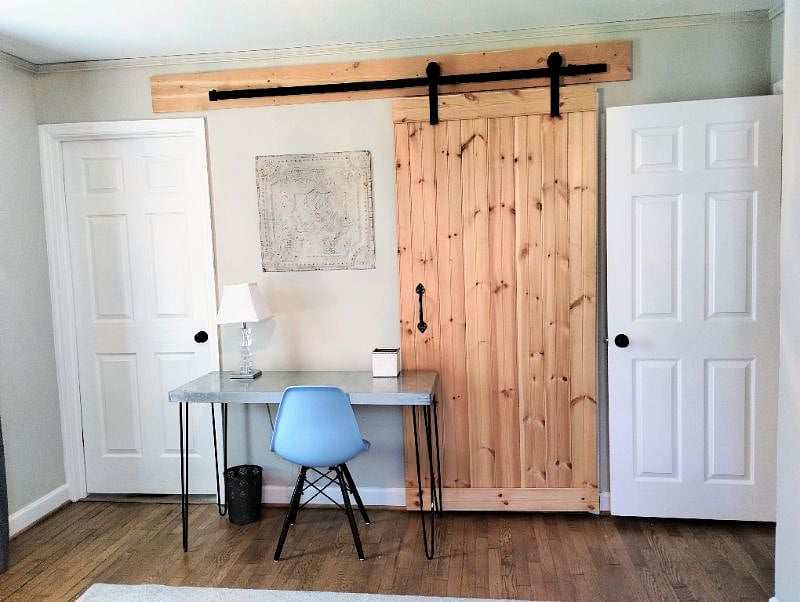 Dedicated workspace in master bedroom. USB ports and lamp. Barn door covers walk-in closet. Back to the left hall to the right