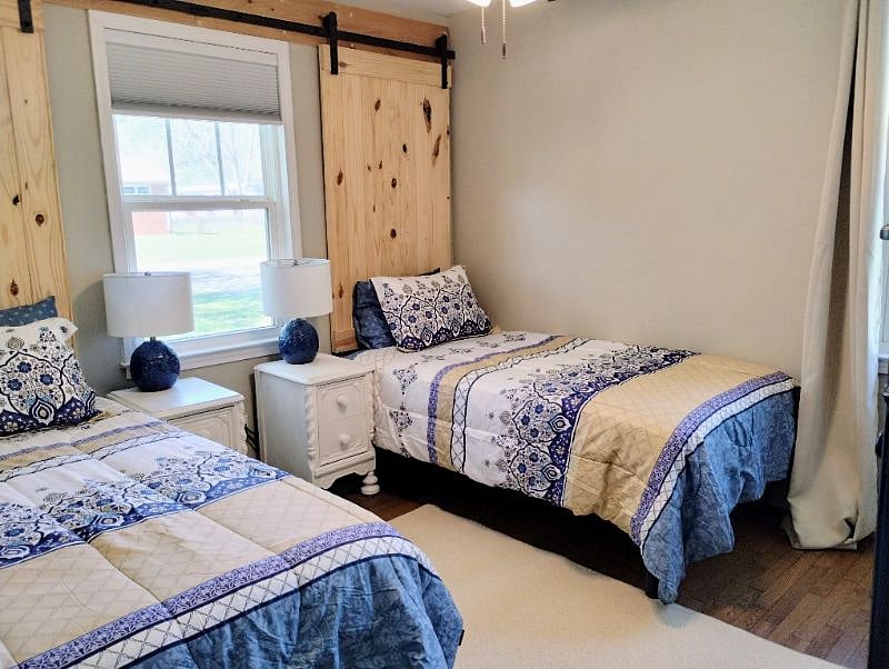 Guest bedroom has twin beds with memory foam mattresses and a step in closet. This bedroom can be converted to a king bed with notice