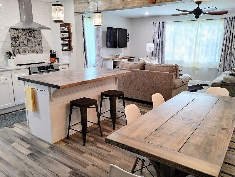 View from the dining area to the kitchen and living room. Professionally designed