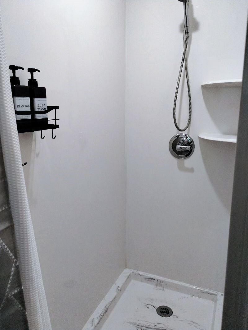 Master bath large walk-in shower with bath products